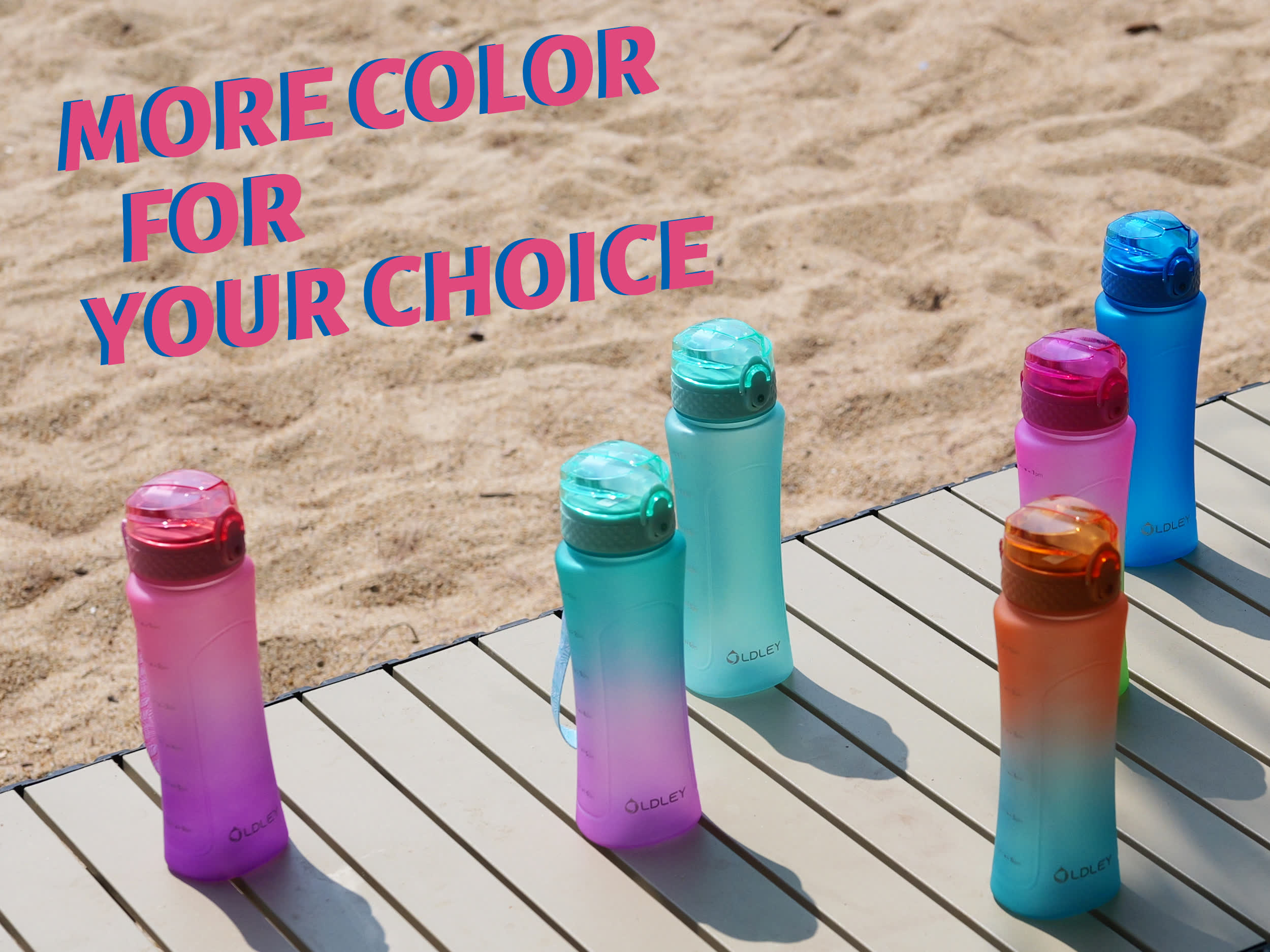 five colorful gradient water bottles in pink teal light blue and orange on wooden table at sandy beach