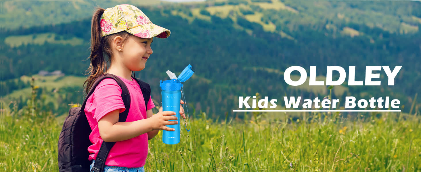young girl in pink shirt and floral cap holding blue water bottle with flip top lid standing in green meadow with hills