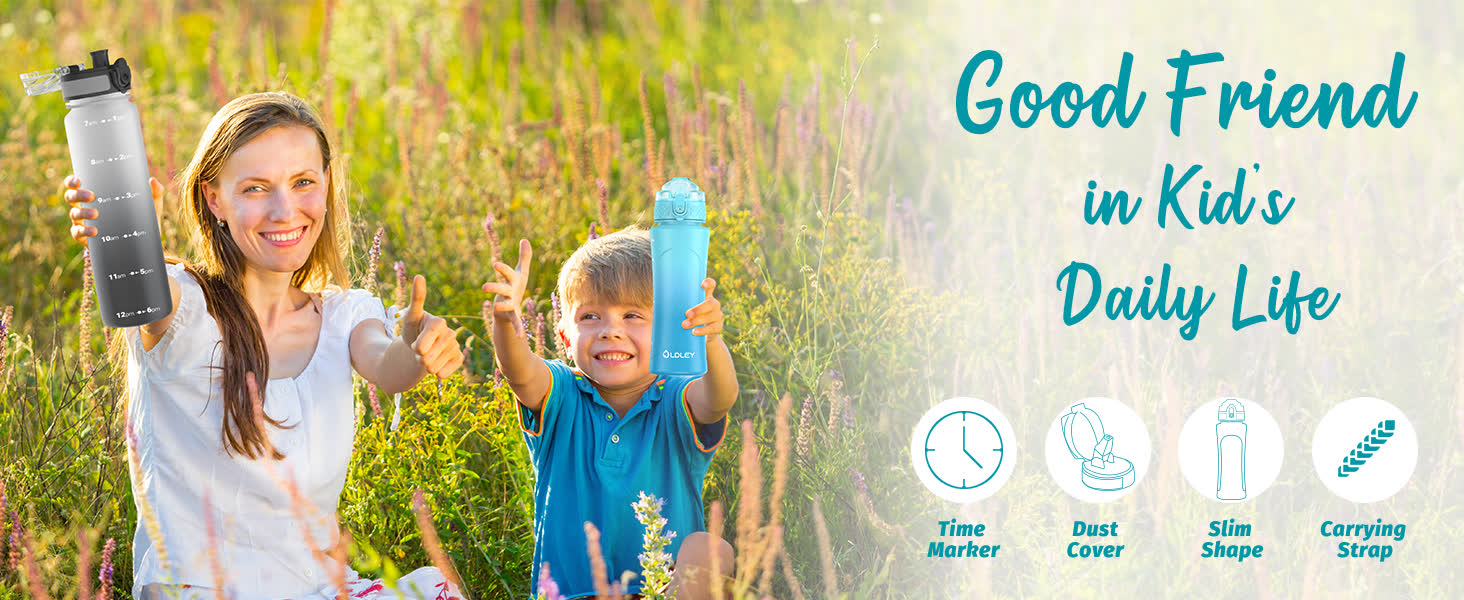 woman and young boy sitting in field of tall grass and purple flowers holding gray and blue water bottles
