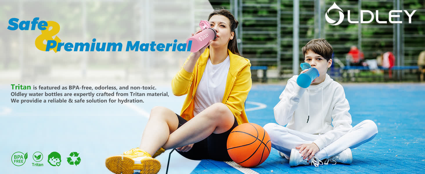 woman in yellow jacket and boy in white hoodie drinking from water bottles on blue basketball court with orange basketball